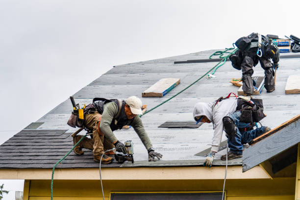 Professional Gutter Installation technician working in Garden City, NY